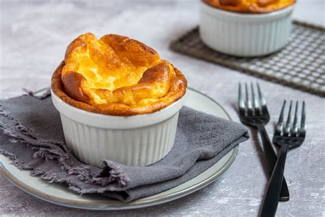 The best soufflé dishes are the ones made from pottery or ovenproof glass with straight sides, which allow the batter to rise to its maximum height. Generally speaking, a 4-eggs soufflé should be baked in a 6-cups (1.5-liter) capacity dish, while a 6-eggs one requires an 8-cups (2-liter) dish. Never use a dish bigger than 8-cups (2-liter .... Souffle recipe